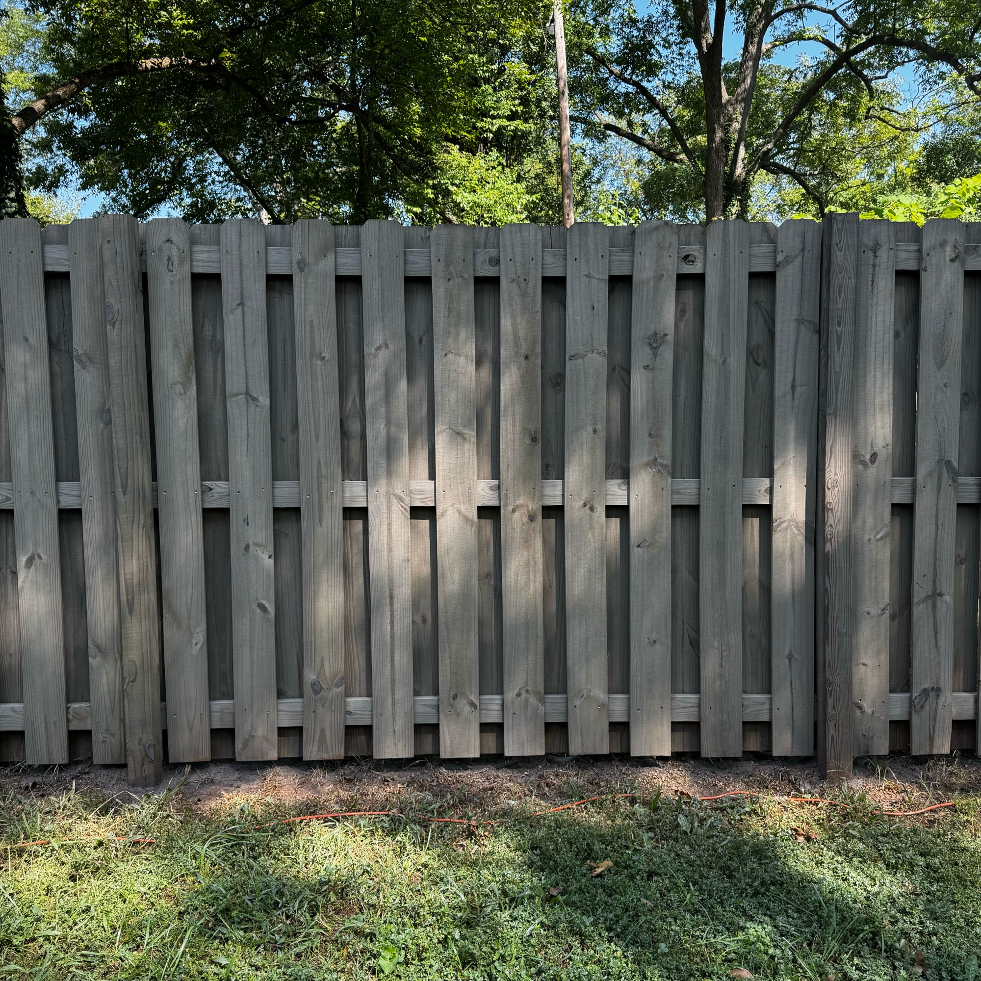 Close detail of stained fence boards and grain