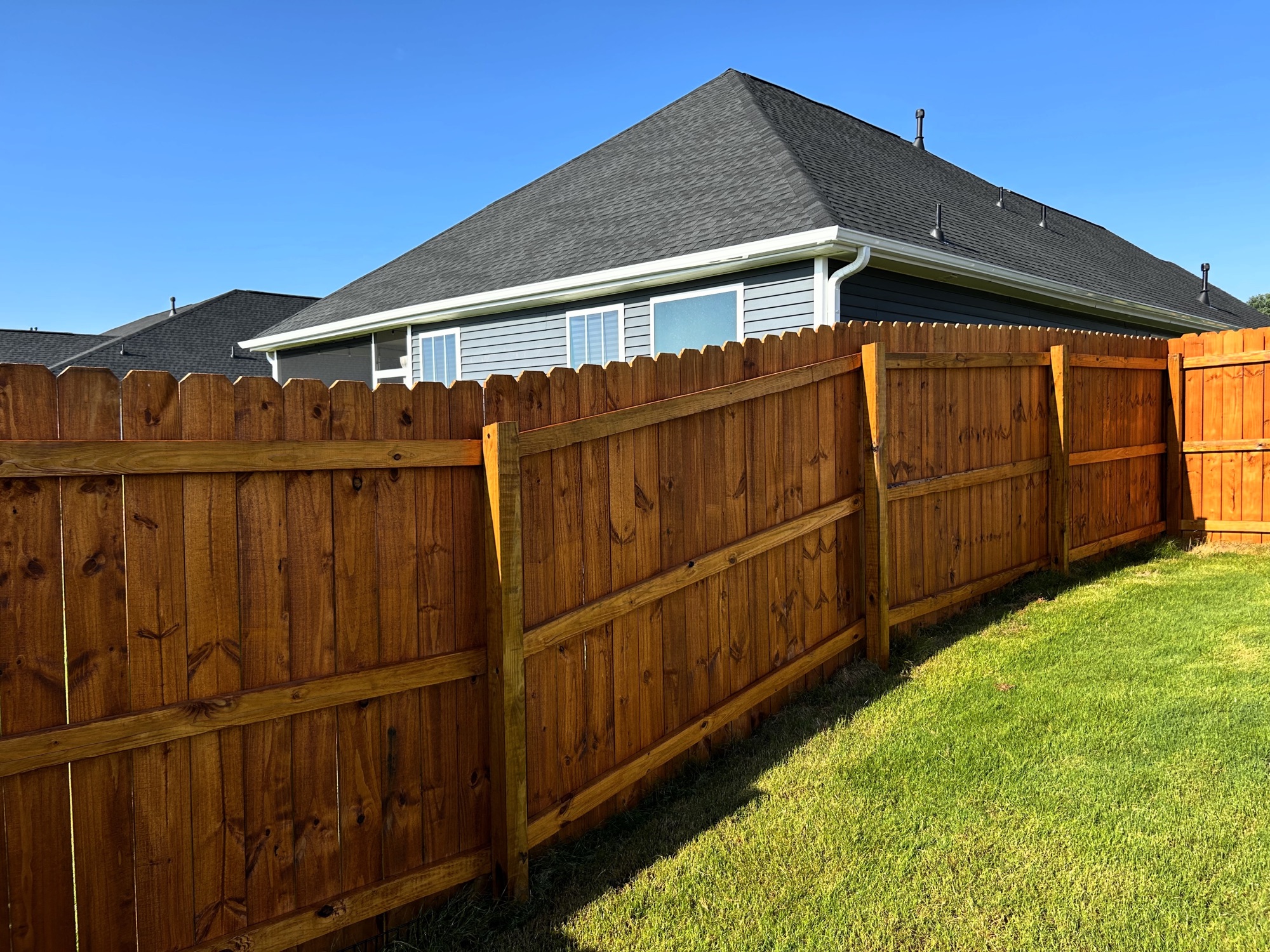 Stained wooden fence and gate